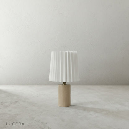 Detail shot of Pandora Table Lamp cream linen pleated shade texture with soft LED light diffusing through fabric