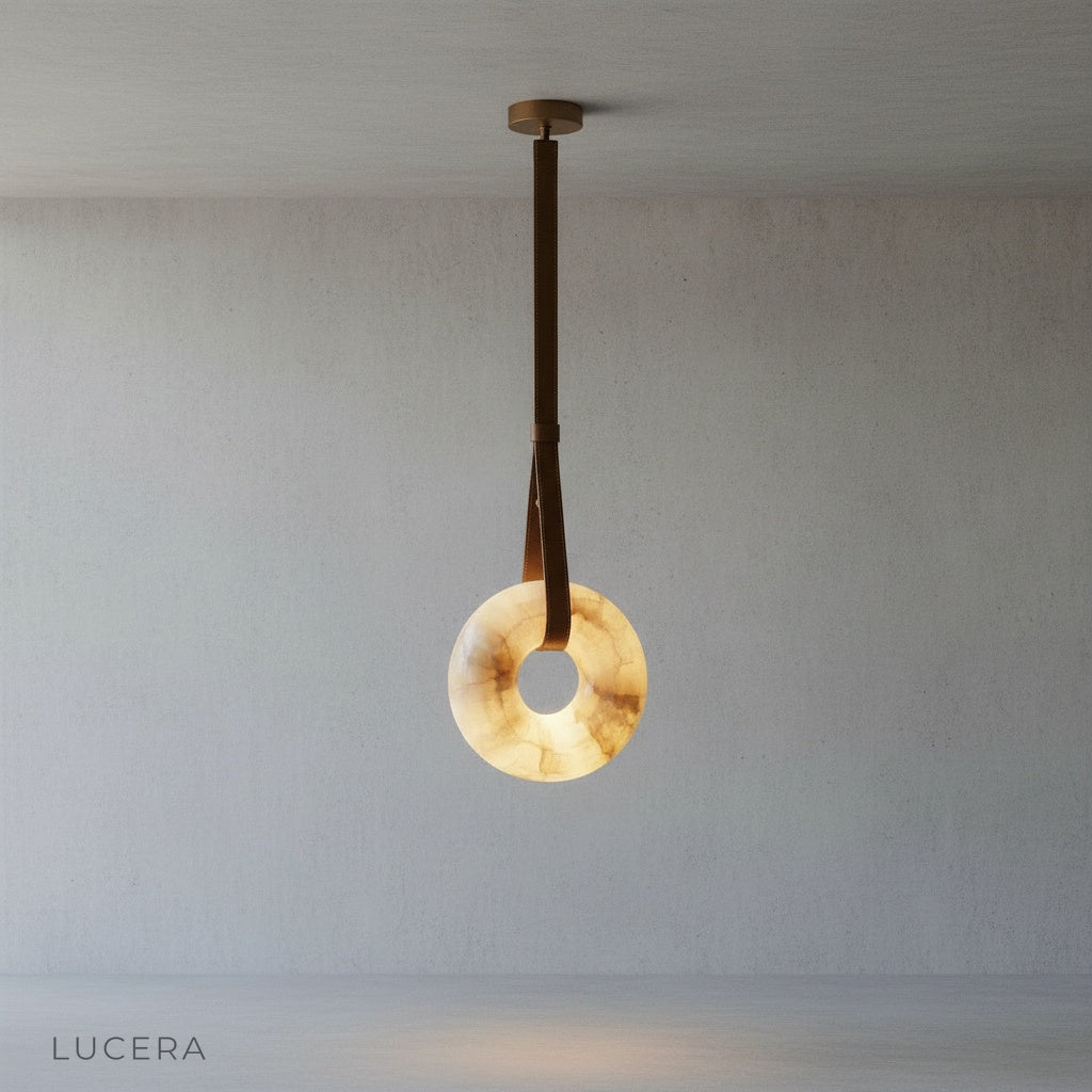 minimalist studio view of Lucera Butte pendant light showing warm alabaster texture