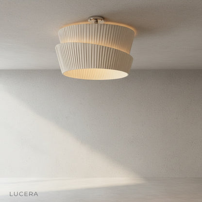 Eulalia ceiling light in neutral beige fabric finish against soft gray wall
