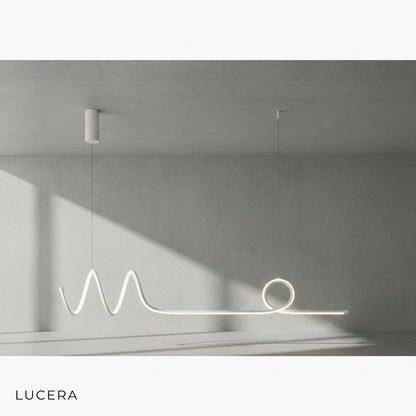 Eira Nordic pendant lamp with long strip in brushed aluminum, hanging above a kitchen island