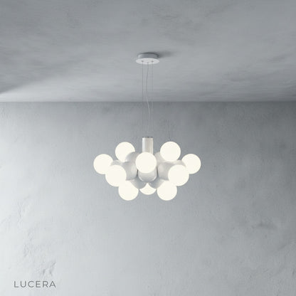 Fascia pendant light cluster hanging over wooden dining table in mid-century dining room