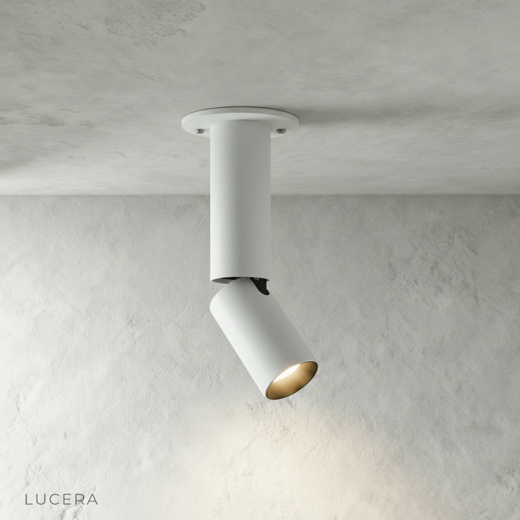 close-up of Bewitch ceiling light cylindrical aluminum head with matte texture and visible pivot joint