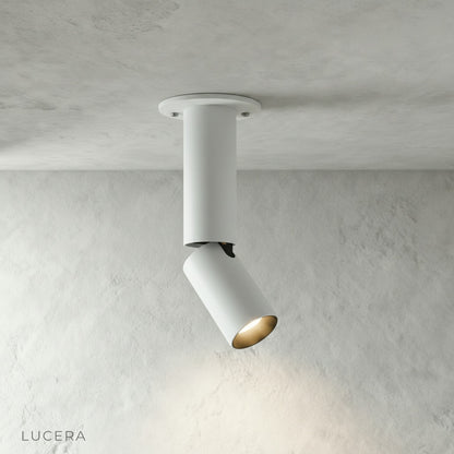 close-up of Bewitch ceiling light cylindrical aluminum head with matte texture and visible pivot joint
