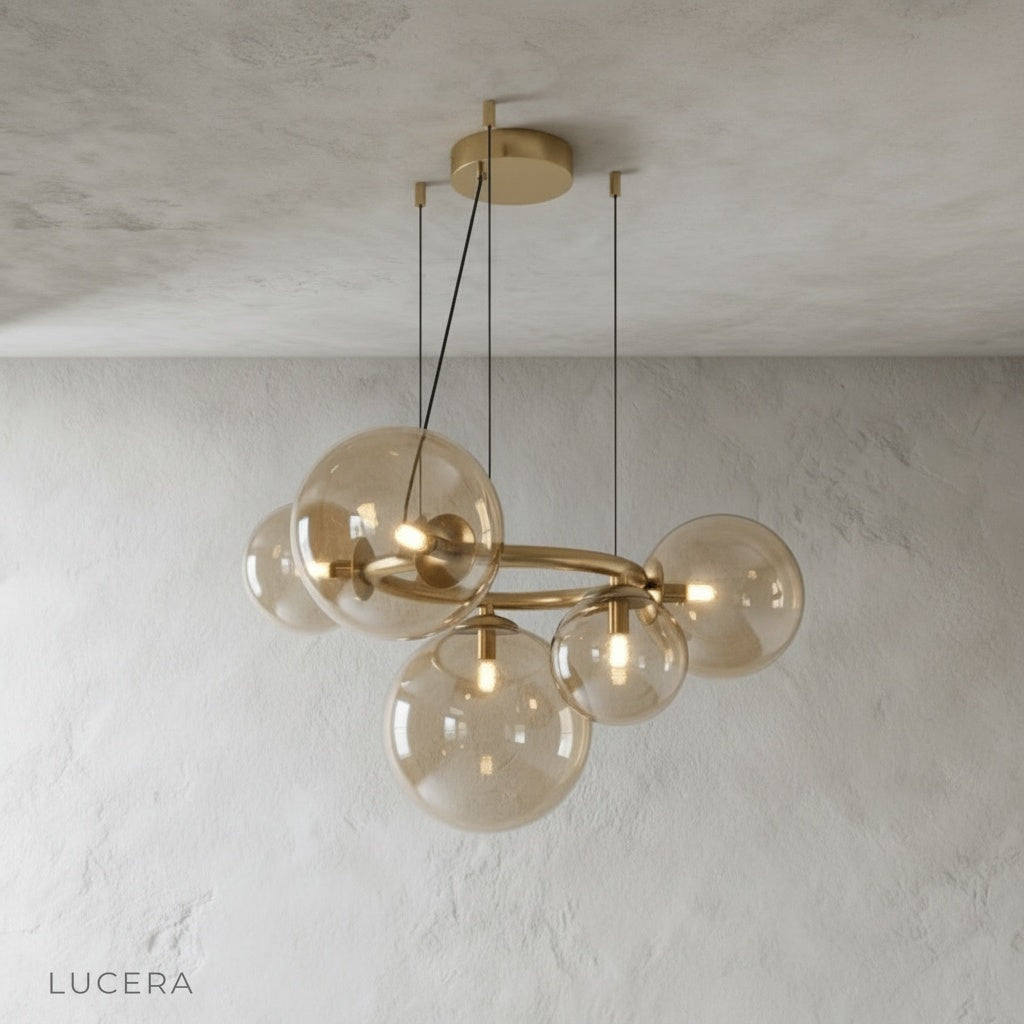 Grenache chandelier with clear glass orbs and brushed gold metal ring