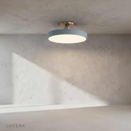 Alizarin ceiling light illuminating a cozy dining nook with warm ambient glow