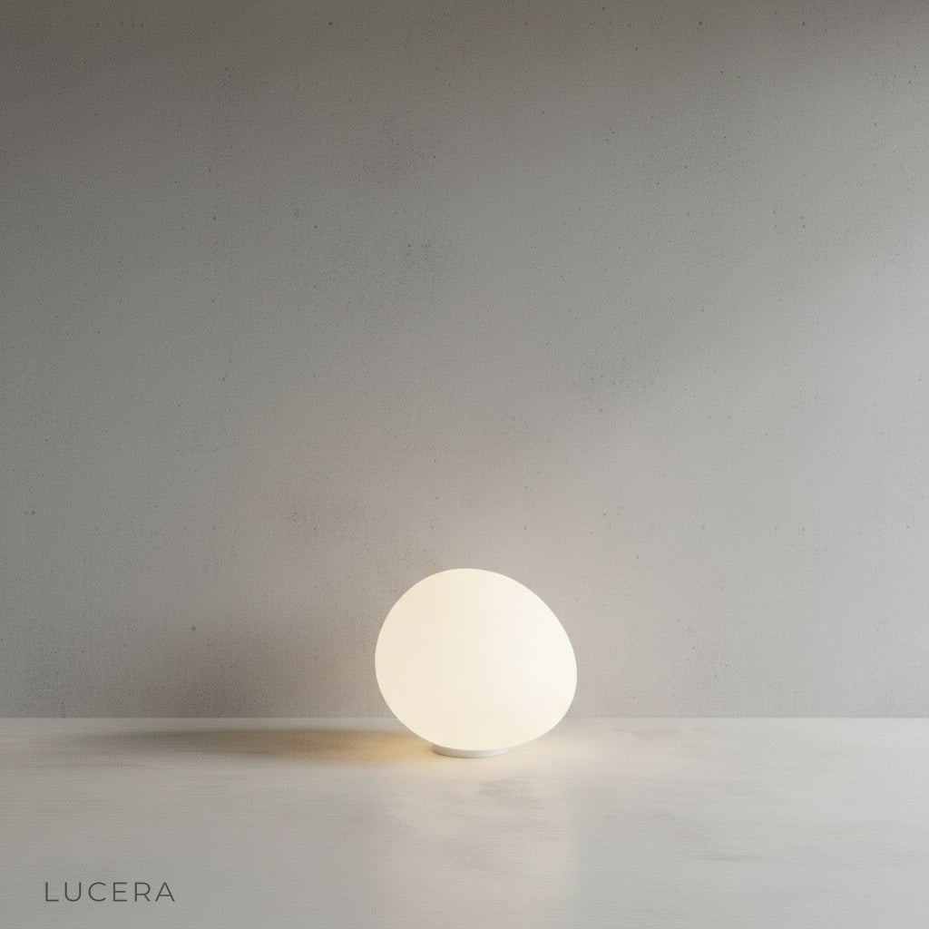 Yttrium Floor Lamp in a cozy bedroom corner casting soft ambient light on a wooden nightstand