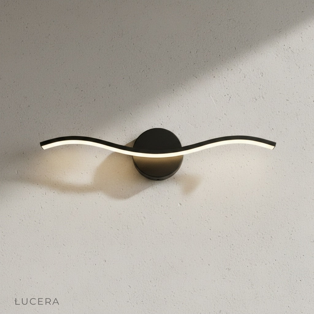 black volcanic wall lamp beside white finish variant in side-by-side studio comparison