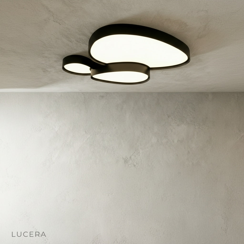 Yielding ceiling light in warm white mode illuminating a cozy bedroom setting