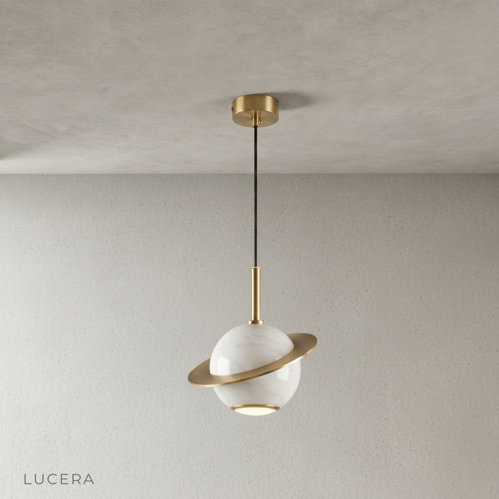 copper ring detail on marble pendant light against neutral wall