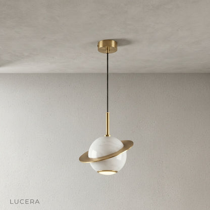 copper ring detail on marble pendant light against neutral wall