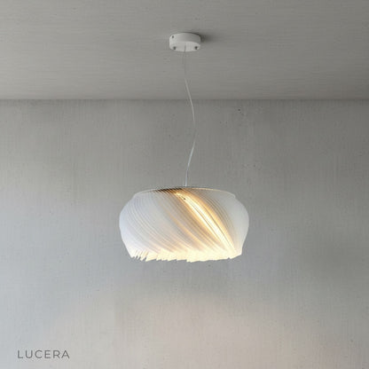 Theron chandelier hanging in bright contemporary entryway with soft ambient light