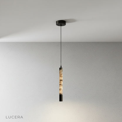 Yseult pendant light side profile showing slim cylindrical silhouette and brushed steel hardware detail