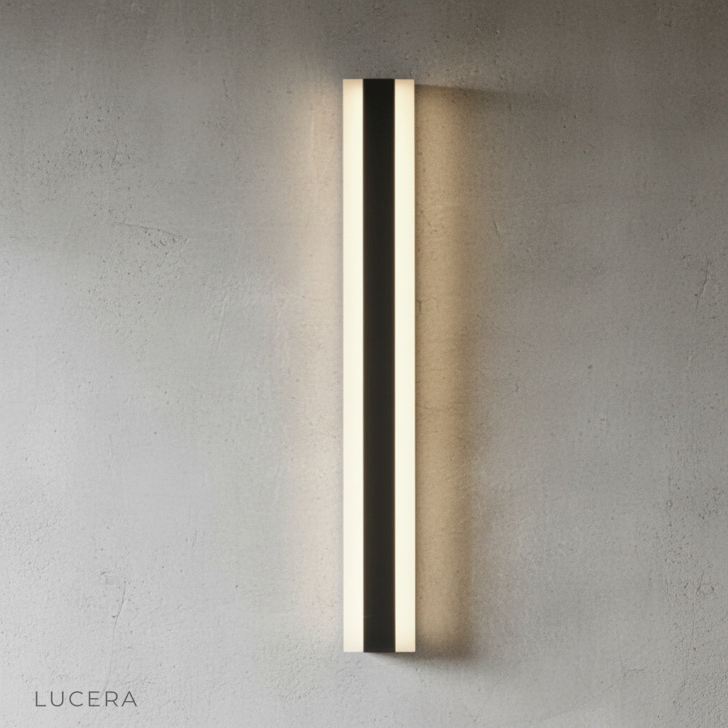 Drambuie wall lamp angled view highlighting slim profile against neutral gray wall