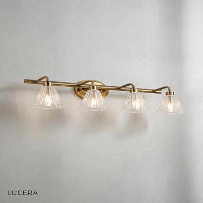chrome and glass wall sconce mounted above a sofa in a stylish lounge