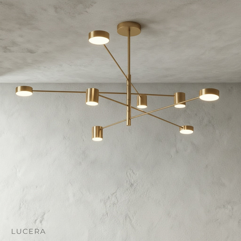 Winsor Blue Chandelier illuminated with warm bulbs in a minimalist studio setting