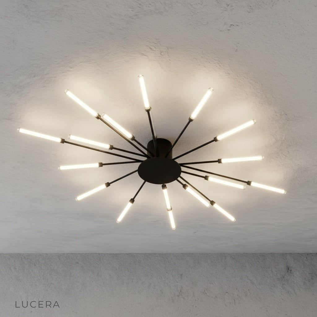 close-up of Karma chandelier LED bulbs and brushed metal connectors against dark backdrop