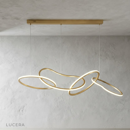Yakitori chandelier glowing in a bedroom with neutral tones and soft textiles