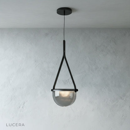 Glimmer pendant light with warm filament bulb visible through clear glass shade