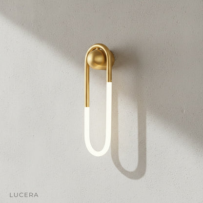 Ximena Wall Lamp in warm ambient light against textured plaster wall