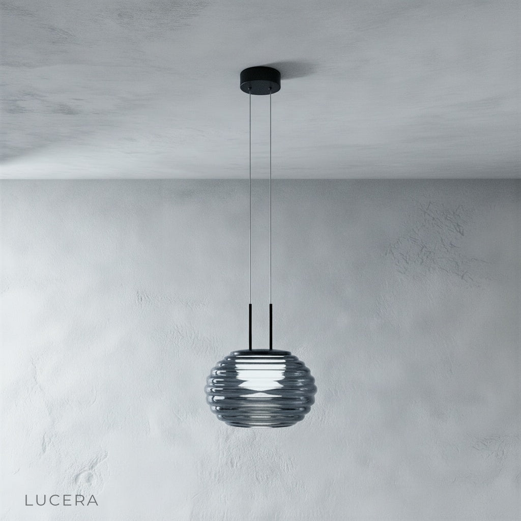 Gareth pendant light with warm diffused glow hanging above a kitchen island