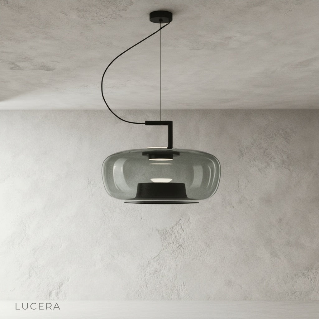 Close-up of Yardang pendant light grey glass shade showing smooth metal finish and bulb detail