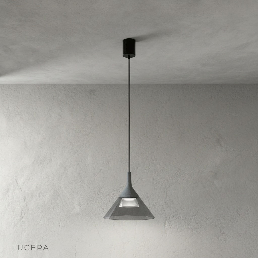 Calypso Pendant Light in brushed brass finish, clear acrylic shade detail against grey backdrop