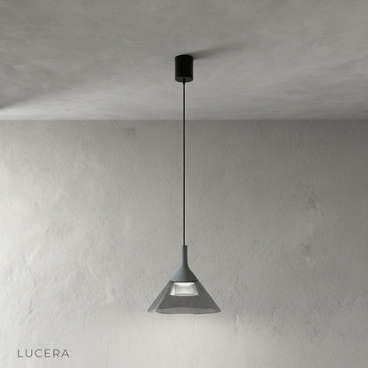 Calypso Pendant Light in brushed brass finish, clear acrylic shade detail against grey backdrop