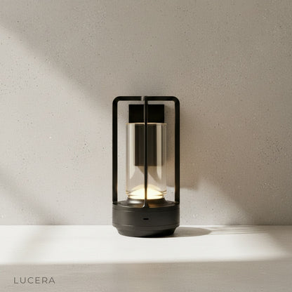 Karmelite Table Lamp in warm 2200K setting on minimalist bedroom nightstand