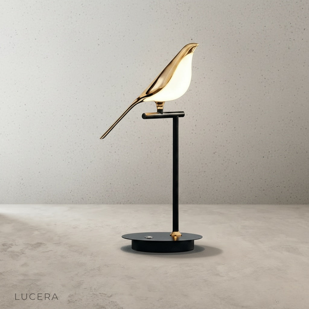 Vento Table Lamp in matte black finish on wooden desk with books and ceramic vase