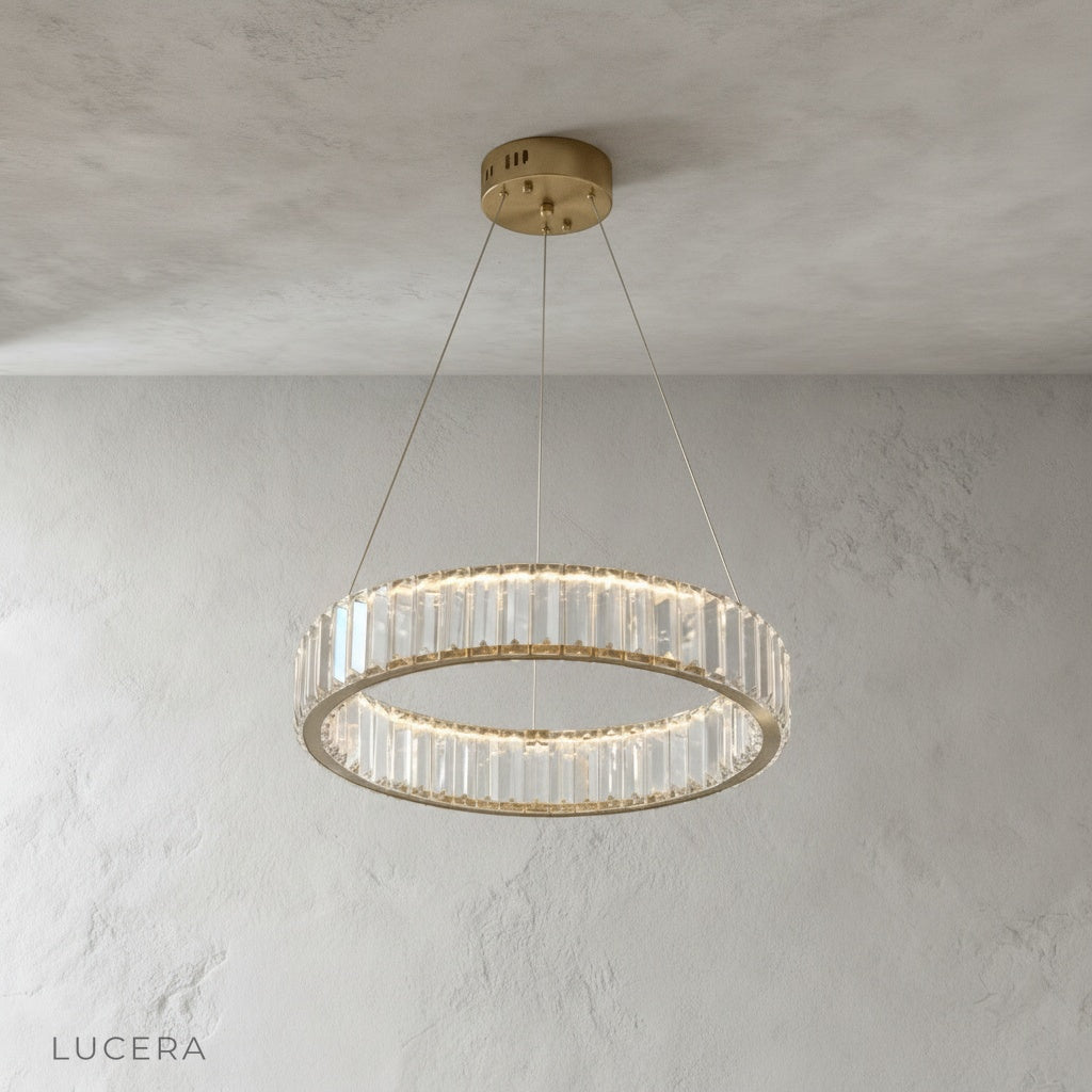 Carmelite chandelier hanging in stairway with warm ambient light