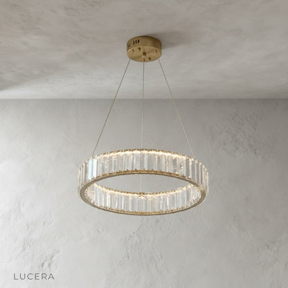 Carmelite chandelier hanging in stairway with warm ambient light