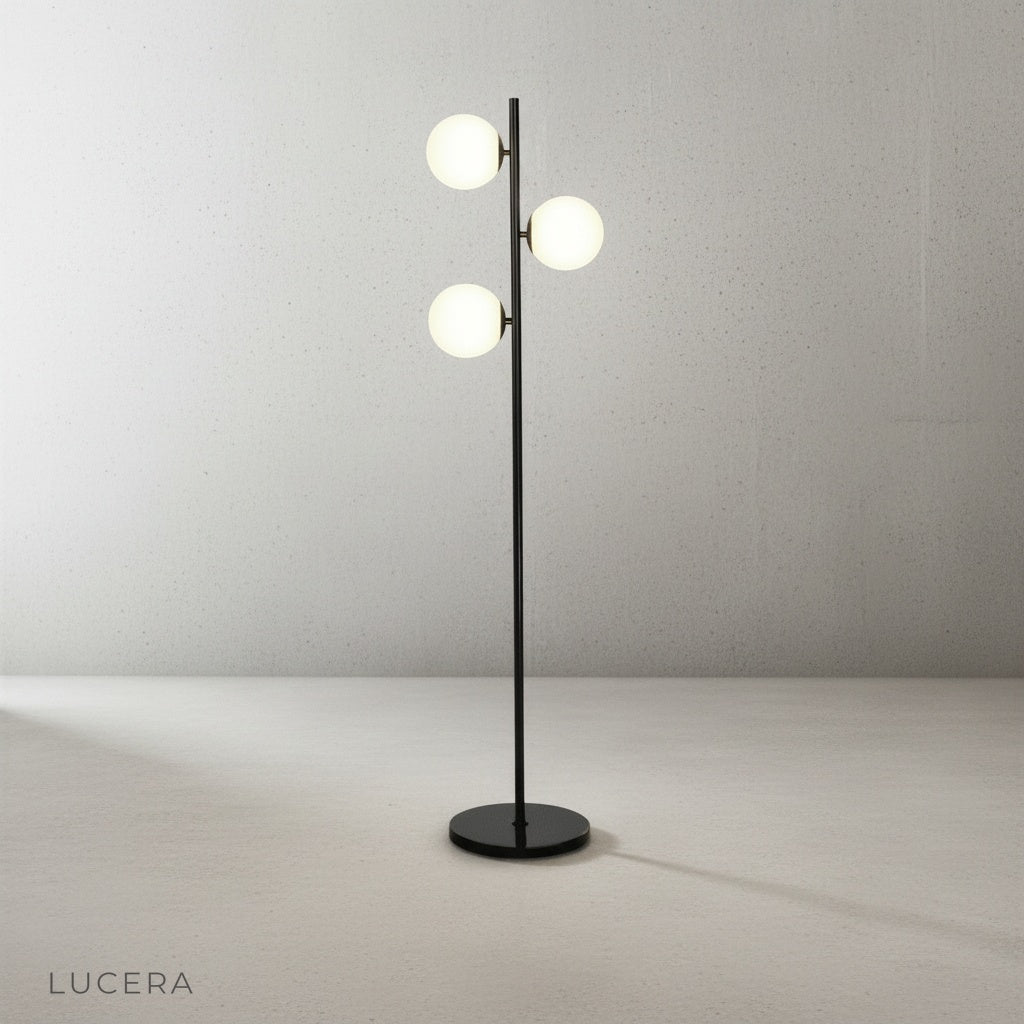 Detail shot of milky white glass shade diffusing warm light from the floor lamp