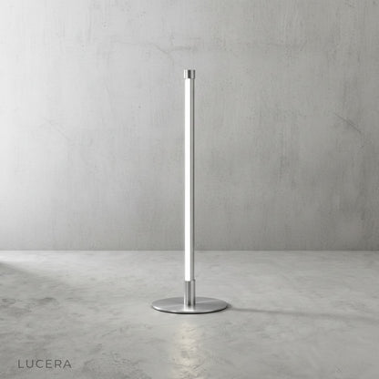 Pascal Table Lamp in matte finish against a soft beige wall, ambient light casting a halo