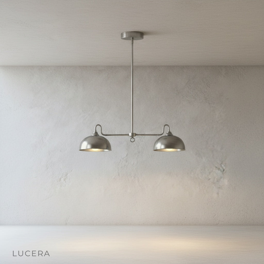 Montepulciano pendant light side profile showing extended horizontal double-dome shape against white wall