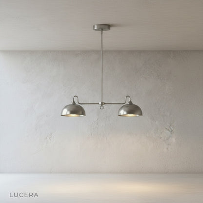 Montepulciano pendant light side profile showing extended horizontal double-dome shape against white wall