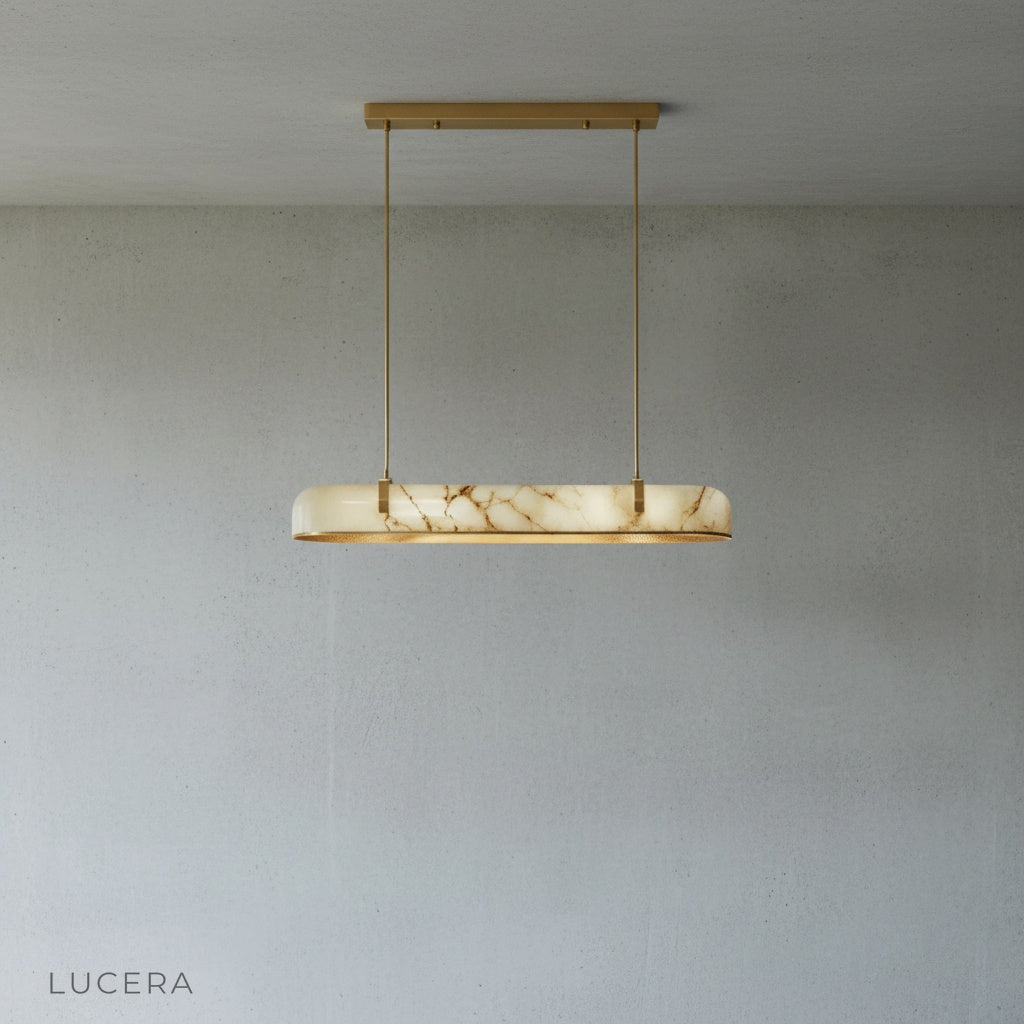 Nerissa chandelier in a kitchen island setting with warm ambient lighting and wooden stools