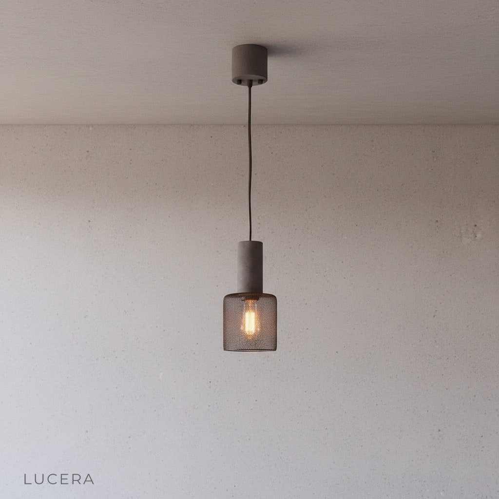 Ridge Pendant Light in matte black finish suspended in a bright kitchen island setting with contemporary stools