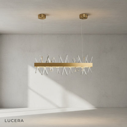 Arte chandelier with warm ambient light in cozy evening living room