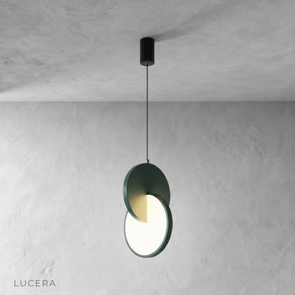 Unveil pendant light in matte black finish hanging over wooden dining table in loft