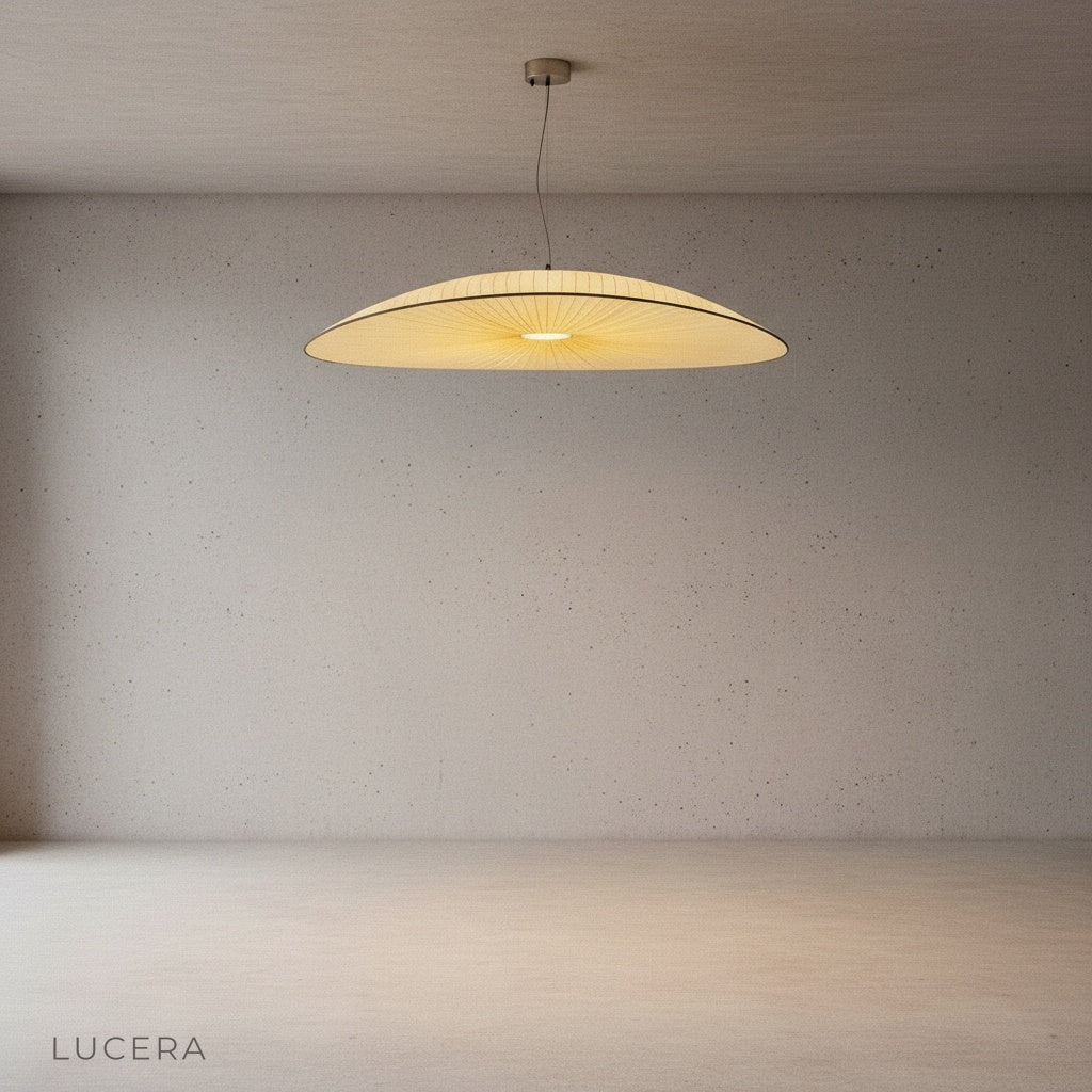 angled view of Dart Silk Chandelier highlighting organic curved arms and pendant drop in minimal studio space