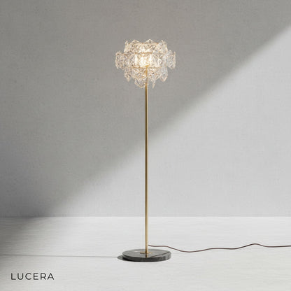 close-up of sunstone crystal prisms refracting light on copper lamp fixture