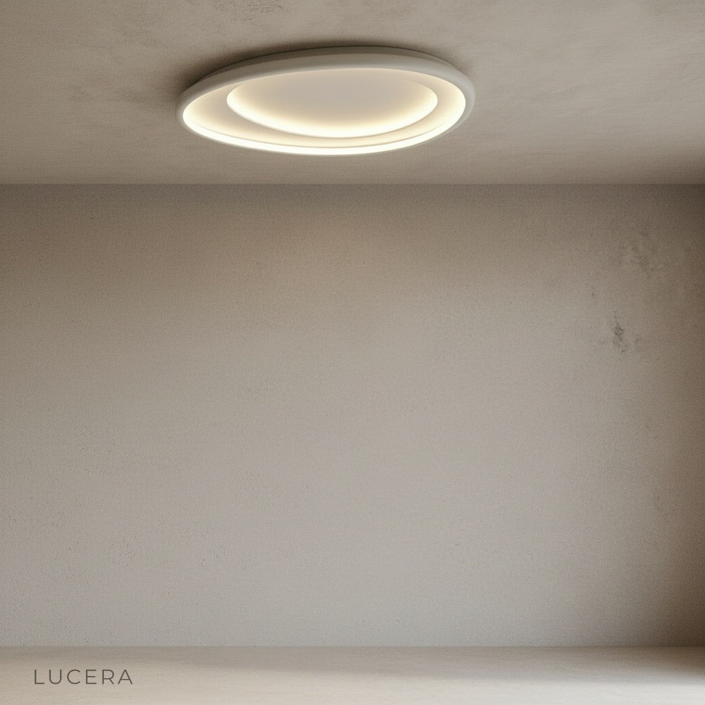 Tantalus ceiling light suspended over dining table with warm ambient light