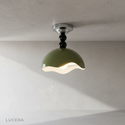 Close-up of Aegis ceiling light wave-edged glossy exterior and smooth interior