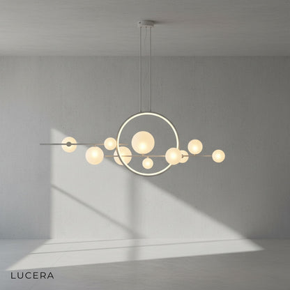 Vor chandelier with adjustable cords at different heights in bright studio setting