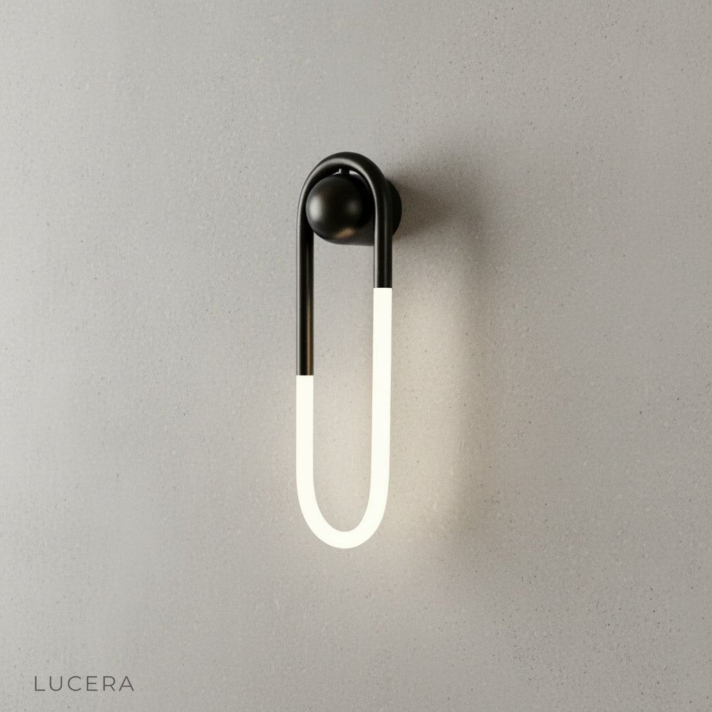 Ximena Wall Lamp illuminating cozy bedroom nightstand at dusk