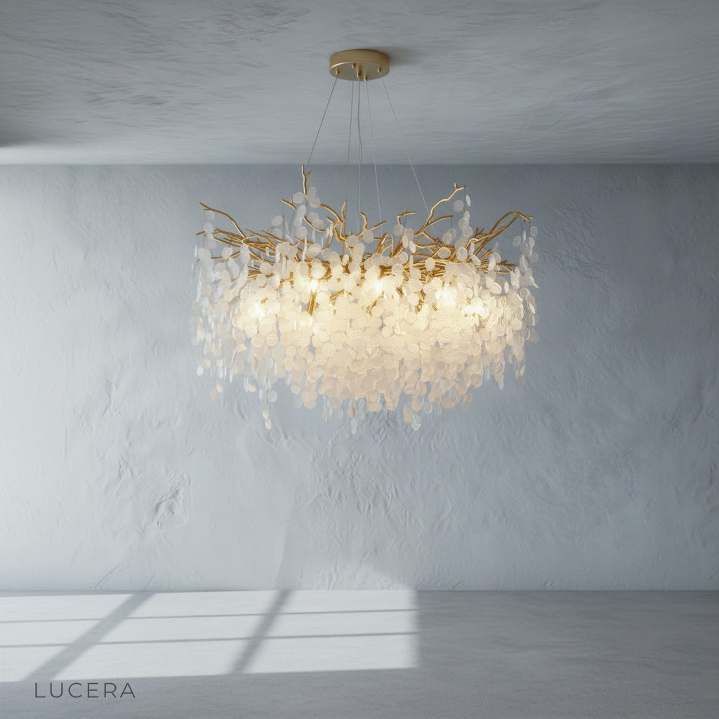 gold chandelier with crystal cascade above dining table