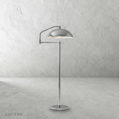 Caledon floor lamp in reading corner beside armchair with warm light