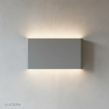 Cadmium wall lamp with three light modes illuminated in soft white
