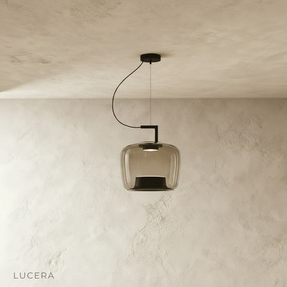 Yardang pendant light green glass shade hanging above wooden kitchen island with bar stools