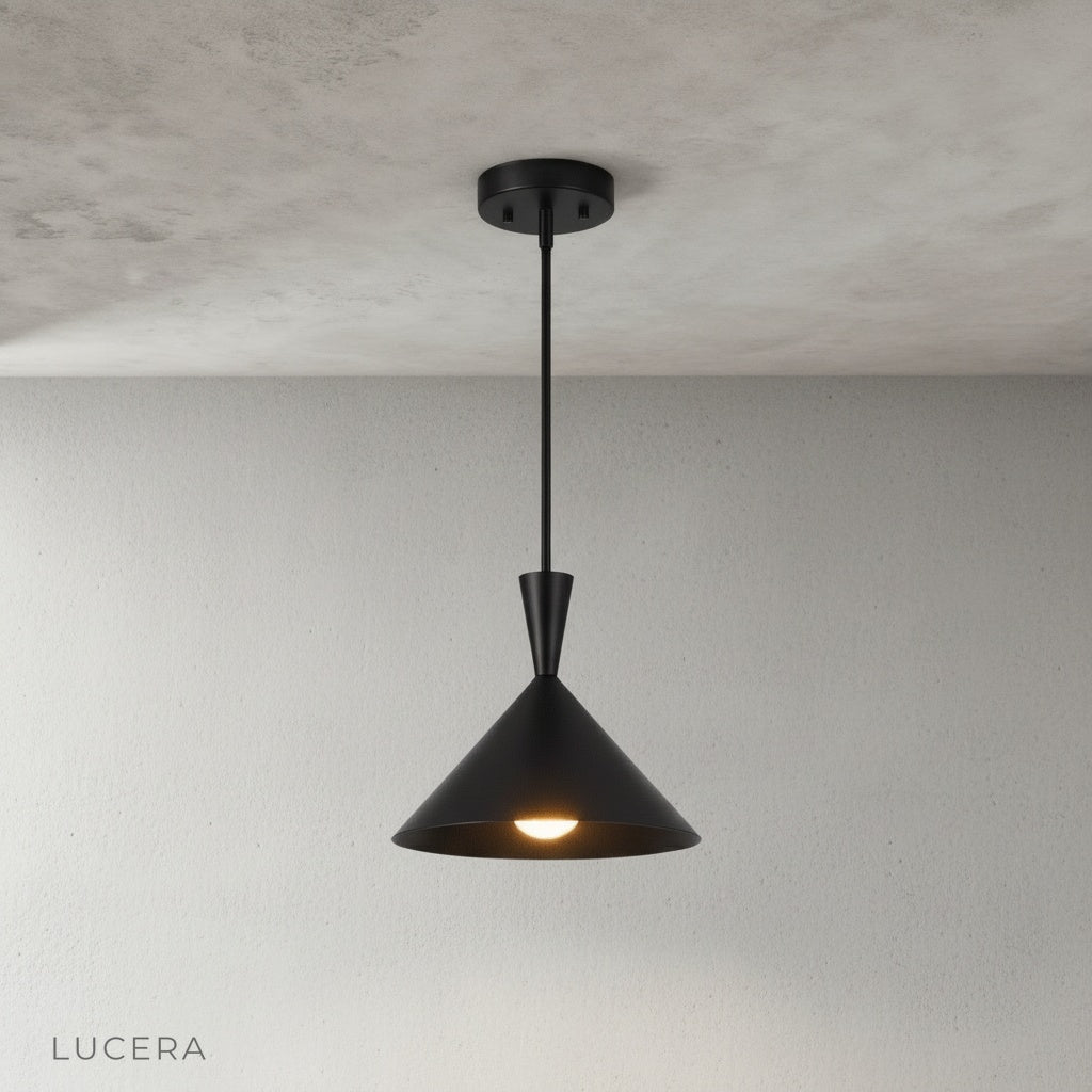brass sconce pendant light illuminating a dark hallway with soft ambient light at dusk